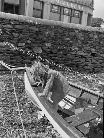 CHILD MENDING ROW BOAT